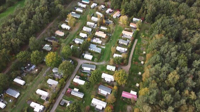 Aerial view of campsite with mobile home caravans near a forest in The Netherlands
