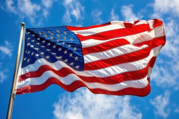 Fototapeta premium majestic american flag billowing proudly in the wind stars and stripes vivid against a bright blue sky symbolizing freedom and patriotism in a dynamic composition