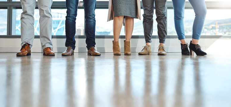 Business people, closeup and legs in workplace, shoes and creative agency for cooperation, waiting and group. Feet, footwear and employees in office, colleagues and startup for graphic designer