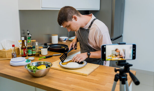 The chef is broadcasting live from workshop how to prepare a grilled eggplants with garlic