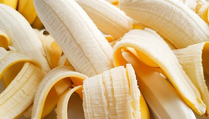 Fresh bananas peeled like a studio photo fill the background. product photo. harvest. wallpaper