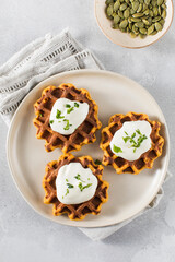 Vegetarian sweet potato waffles with natural yogurt. Healthy breakfast.