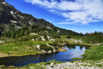 Lac Longue, a small lake in the Aosta Valley, located along the path that goes from Coumarial to the Barma refuge