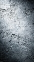 A grey wall with cracks and holes