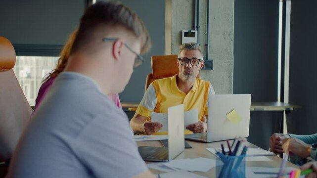 Person with learning disability raising hand during meeting