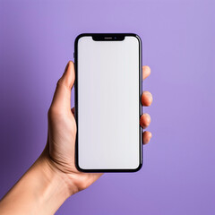 Hand holding the black smartphone with blank screen and modern frame less design on pink colour background