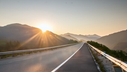 Fototapeta premium Empty highway stretching towards a vibrant sunrise over mountains. 