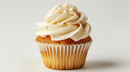 Tasty vanilla cupcake with creamy swirl on a white backdrop