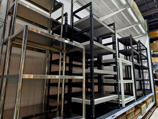 The warehouse has shelves and boxes for storage of materials and supplies