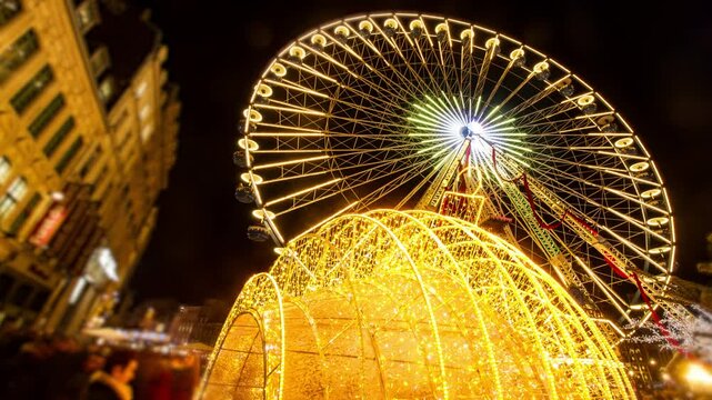 Tunnel of light and Ferris Wheel : Christmas decoration and atmosphere on Lille (France) Main Square