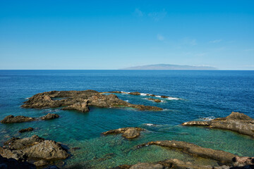 Fototapeta premium Atlantic Ocean and La Gomera Island view from Tenerife Island Spain at sunset