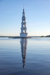 Fototapeta premium Early spring morning at the flooded bell tower of St. Nicholas Cathedral. Kalyazin. Tver region, Russia