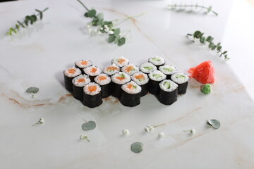 sushi on a black plate