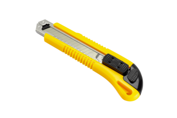 Yellow stationery knife with a blade isolated on a white background with clipping path.
