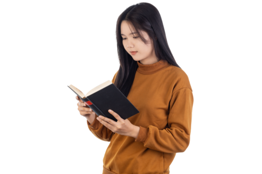 Young Asian woman standing reading holding in hands book isolated on white background with clipping path. studio portrait.