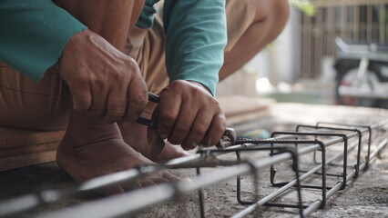 close up installing concrete steel reinforcement used for the casting process