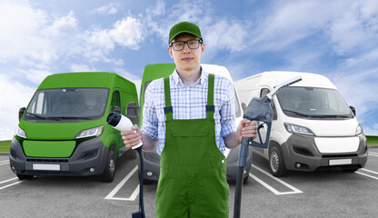 Man wearing green driver uniform holds electric vehicle charging plug and fueling nozzle on a...