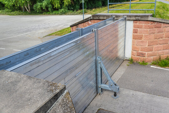 Modern flood barrier on a road, flood gates protecting city against flooding
