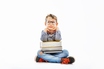 Preschooler with books ready for school. Back to school.