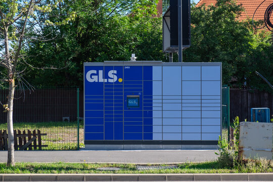 GLS automated parcel locker in Miercurea Ciuc, Romania amidst a residential area. July 7, 2024.