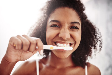 Woman, smile and portrait with brushing teeth in bathroom for dental hygiene, fresh breath and...