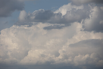 Obraz premium Blue sky. Beautiful Cumulus clouds flying across the sky,