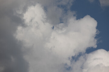 Blue sky. Beautiful Cumulus clouds flying across the sky,