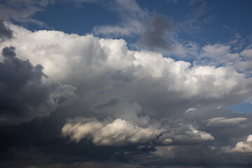 Blue sky. Beautiful Cumulus clouds flying across the sky,