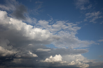 Obraz premium Blue sky. Beautiful Cumulus clouds flying across the sky,