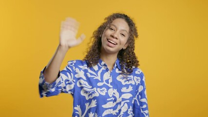 Friendly african eoman waving hand - Hello, Hi, Salute. Greetings on yellow