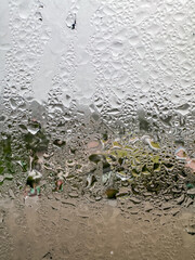 Close up of water droplets on a glass window during the day