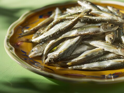 Delightful Boquerones En Vinagre on Plate with Vibrant Green Background in Clear Light