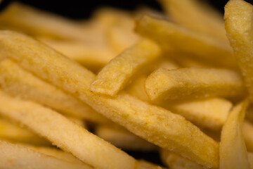 Close-up fries on a dark background