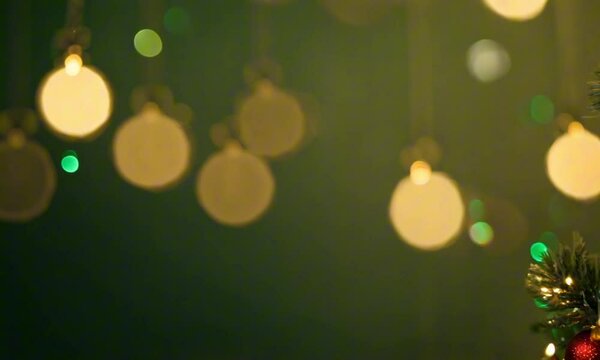 Christmas background with xmas tree and sparkle bokeh lights on green canvas background