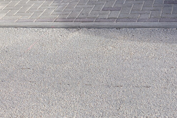 Fototapeta premium blocks on the pavement with an asphalt street surface