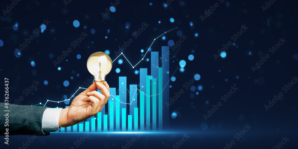 Poster close up of businessman hand with lamp and glowing growing business chart on blurry bokeh background