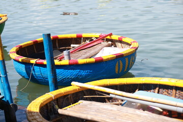 Tourists are joining the Coconut Forest Basket Boat Ride in Hoi An, vietnam. bsaket boat also called vietnamese coracle, is one of local small rounded boat for transport and fishing