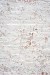 Plaster texture. Pebbled plaster on an old brick wall