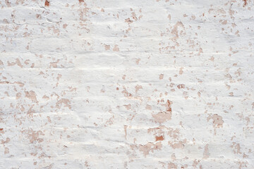 Plaster texture. Peeling plaster on a brick wall. Abstract background