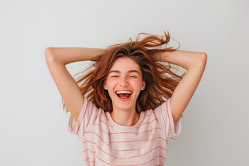 Fototapeta premium Studio portrait of a brunette model with long hair, smiling confidently