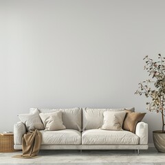 sofa and pillows in front of the empty wall