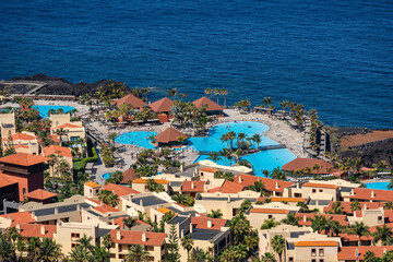 Obraz premium Banana plantations next to a seaside resort on the Canary Island of La Palma, Spain.