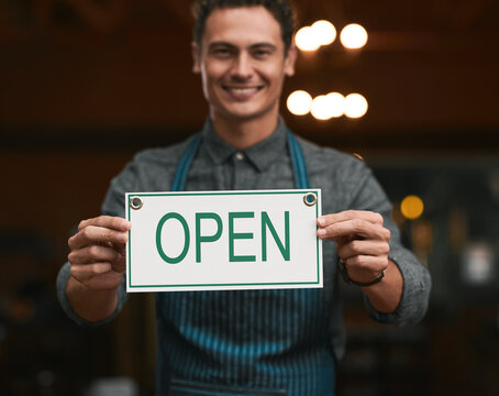 Sign, open and man with portrait smile for service industry, small business launch and announcement in cafe. Entrepreneur, happy manager and welcome board for advertising store, waiter and startup