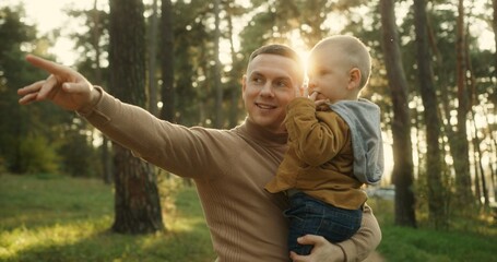 Father and Son's Call of Love in Forest Sunset