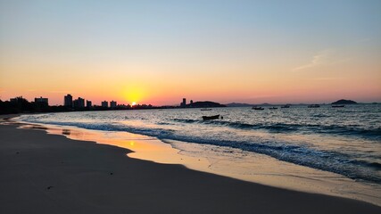 Golden Sunset Over Brazil's Coastal Sands and Waves