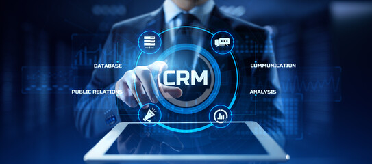 CRM Customer relationship management concept. Businessman pressing button on screen.