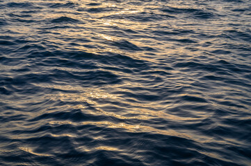 Reflection of vibrant sunset in the calm waters of the ocean