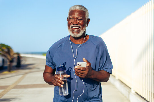 Smiling senior Black man enjoying a morning run