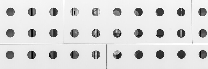 Panoramic image. White metal hole mesh pattern as wall covering	