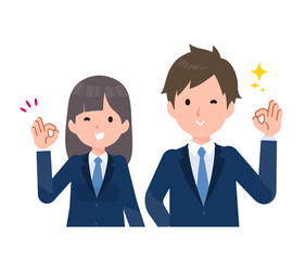 紺色のブレザーを着た学生男女。OKサイン。
